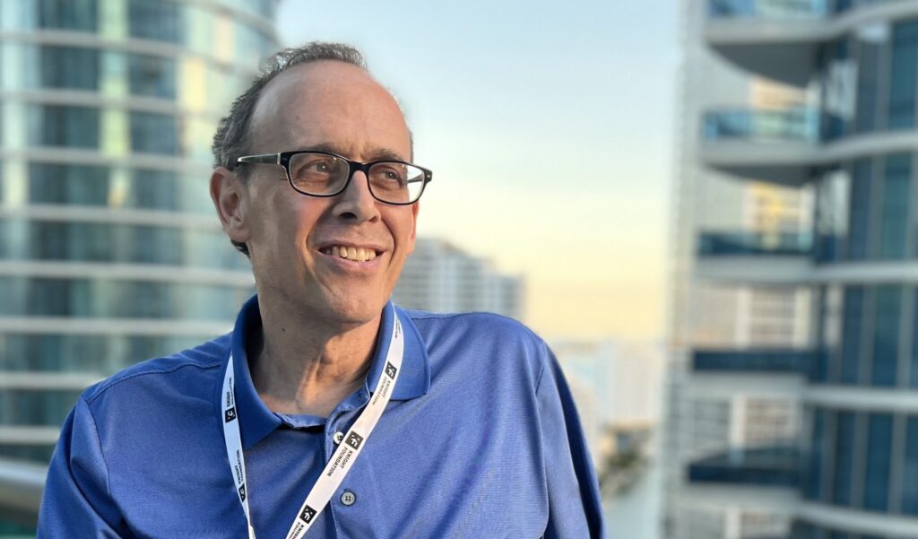 John Heaston with city skyline in the background